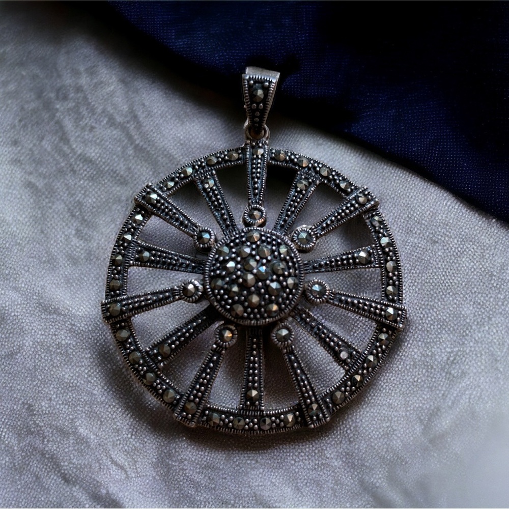 Vintage sterling wheel of fortune pendant with marcacites